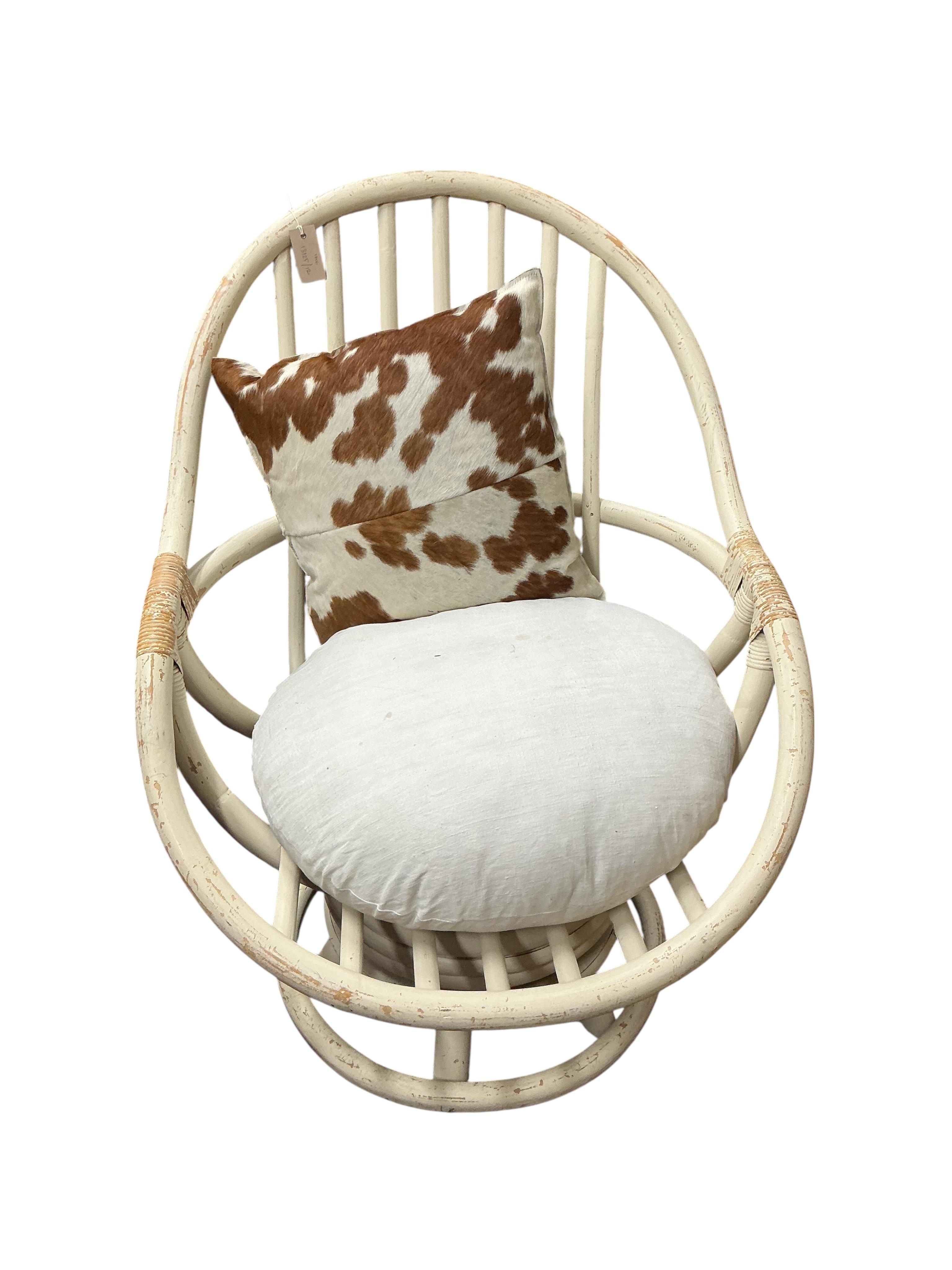 A mid century painted bent cane swivel chair, width 76cm, depth 76cm, height 96cm
